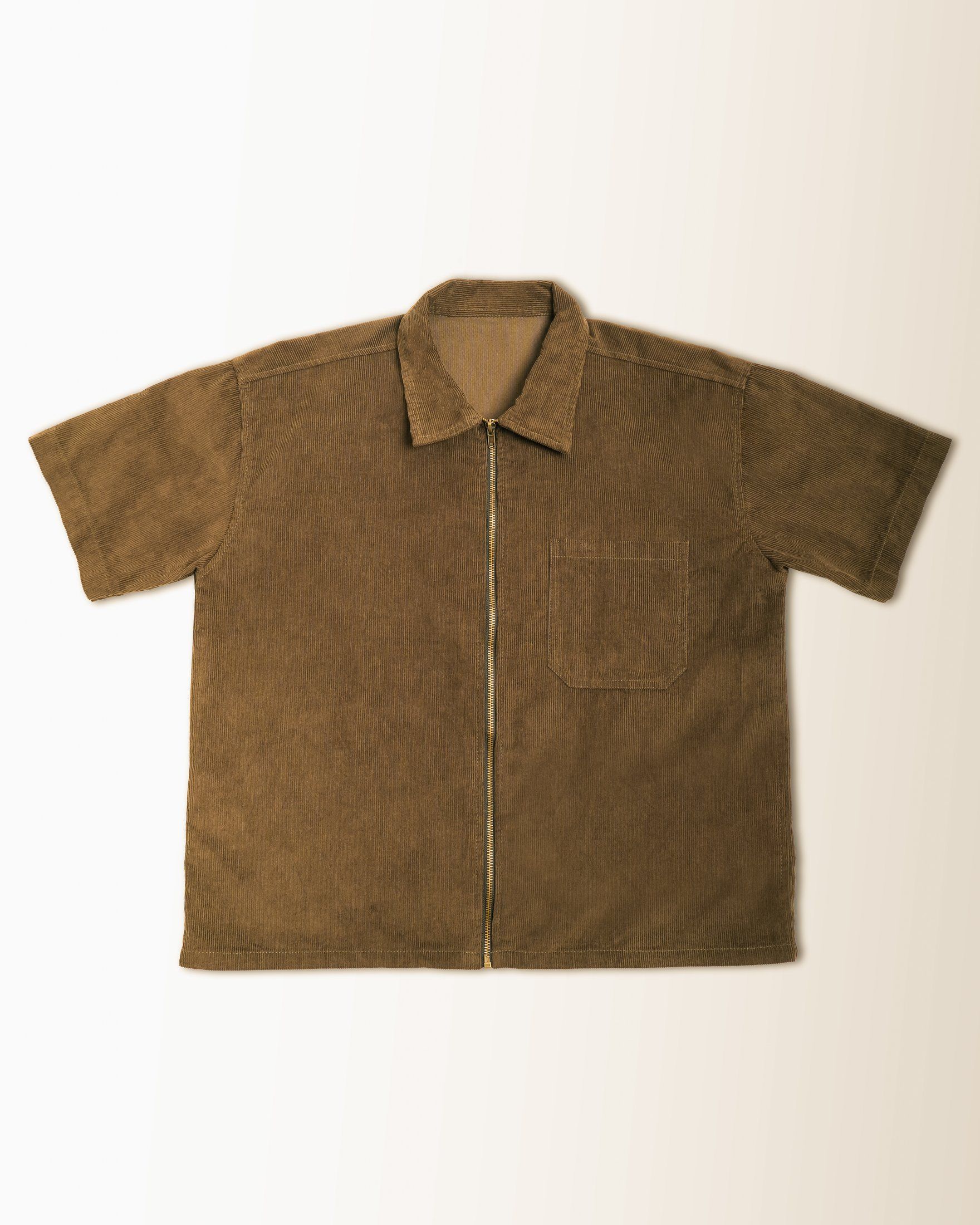 Olive workshirt laid flat with a chest pocket and full zip